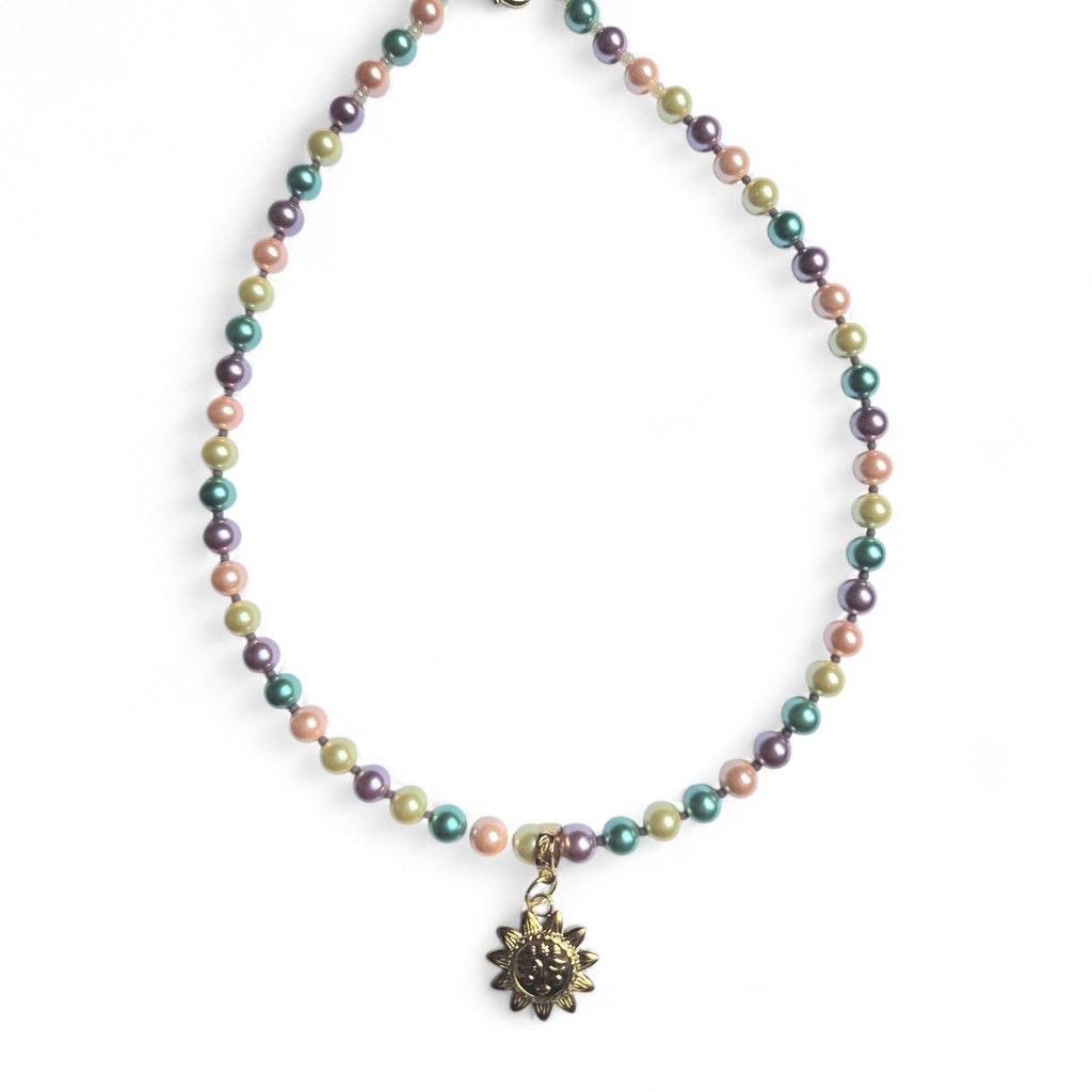 Collar perlas y sol