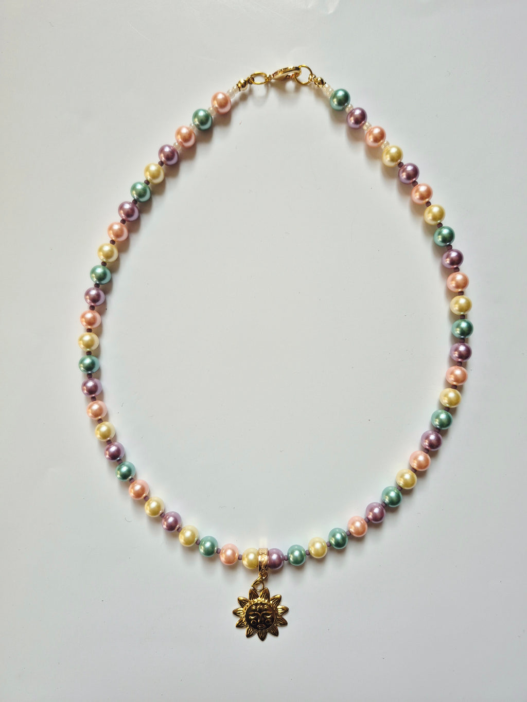Collar perlas y sol