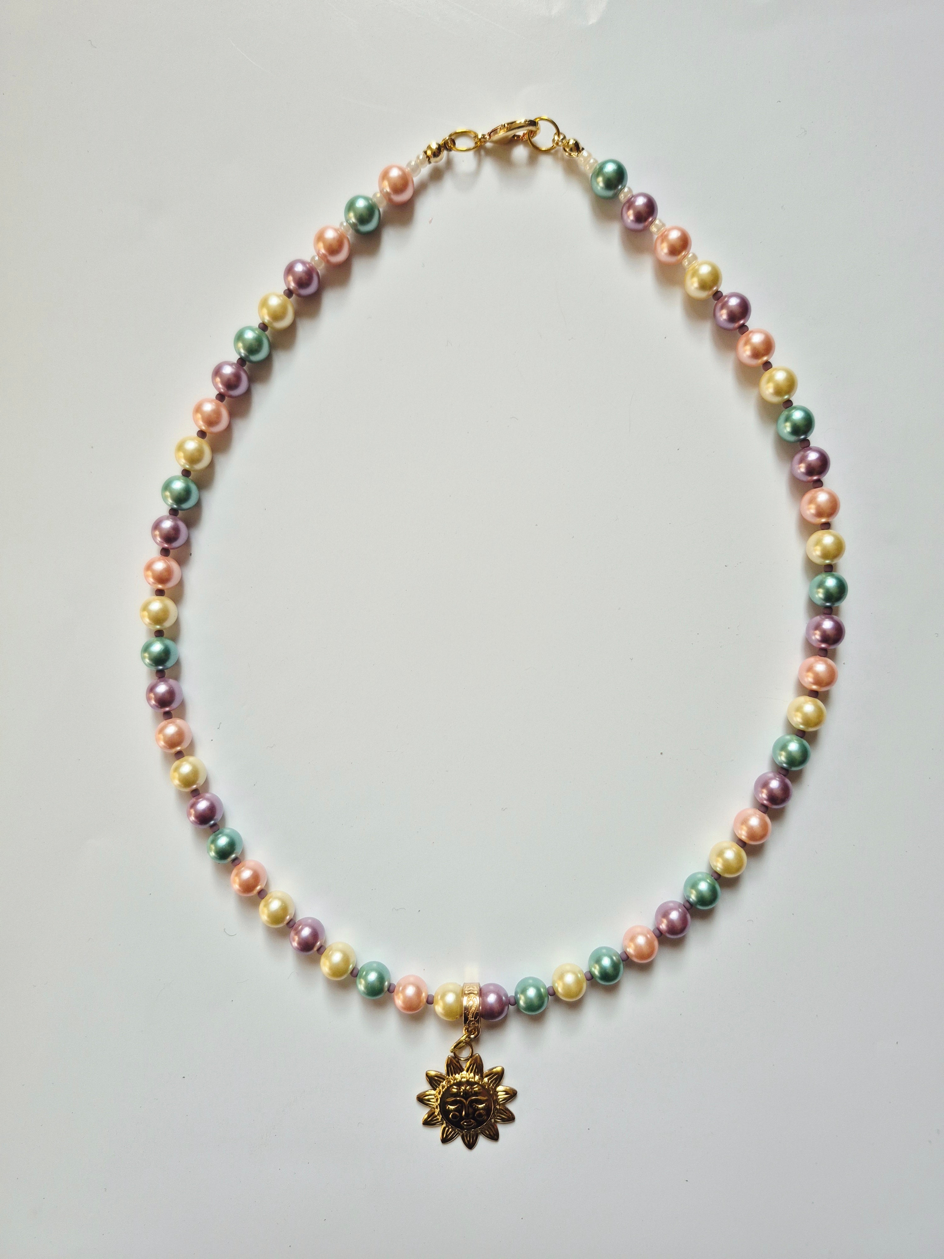 Collar perlas y sol